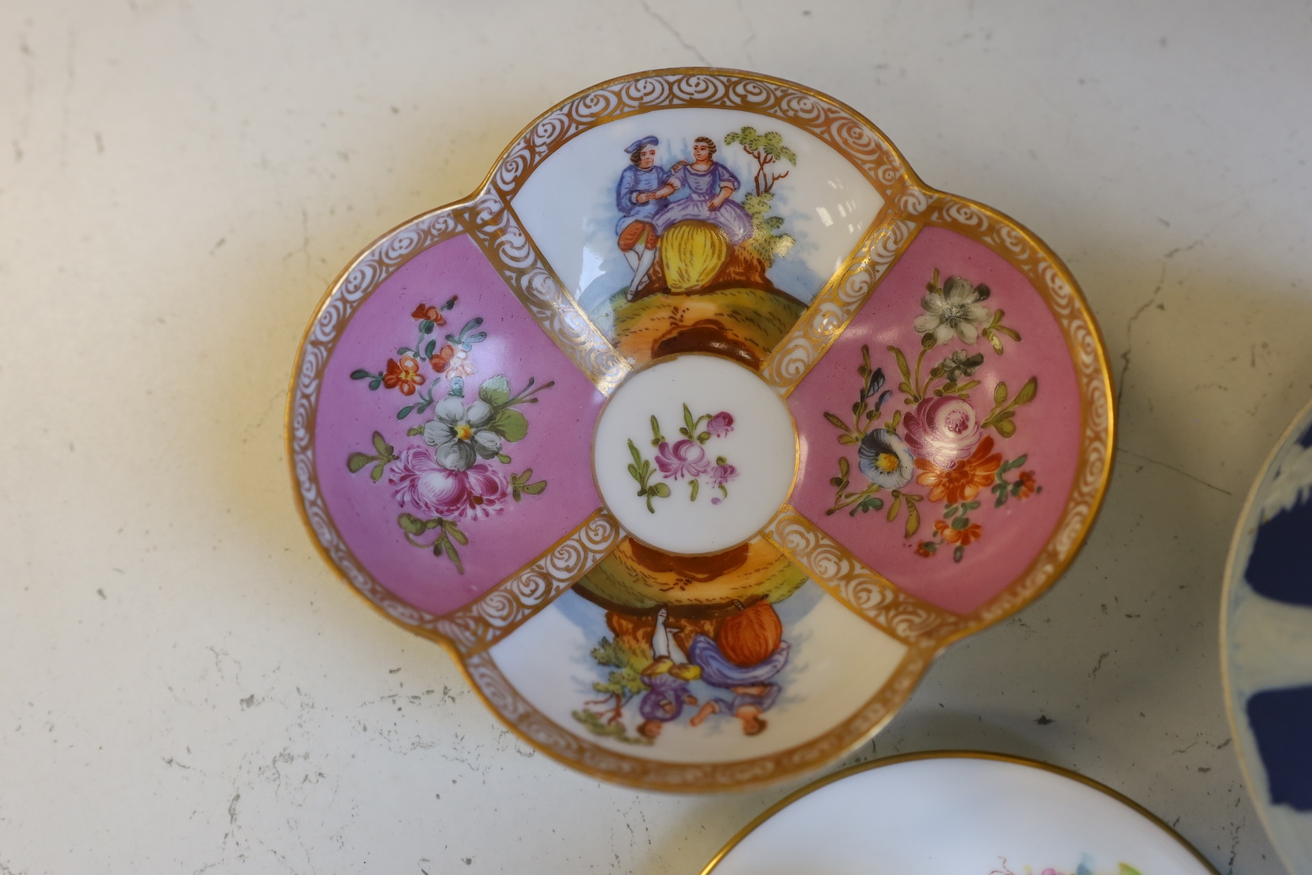 A Wedgwood three colour biscuit barrel with plated rim and handle, a Royal Worcester cup and saucer and a Dresden shaped bowl, biscuit barrel 17cm high. Condition - good